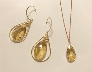 gold swarovski earrings and necklace